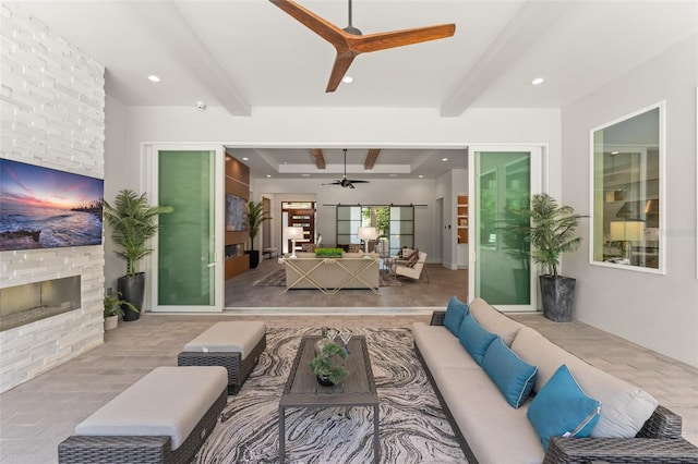 living room featuring recessed lighting, beam ceiling, a fireplace, a ceiling fan, and wood finished floors