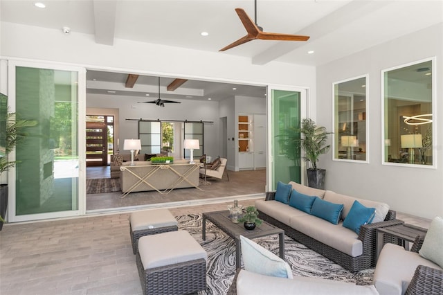 exterior space with recessed lighting, a ceiling fan, beam ceiling, and a barn door