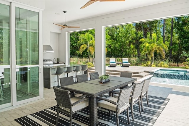 sunroom / solarium with a hot tub