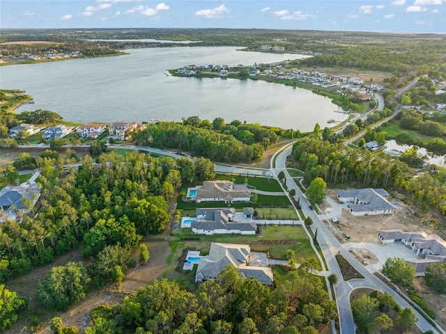 bird's eye view featuring a residential view and a water view