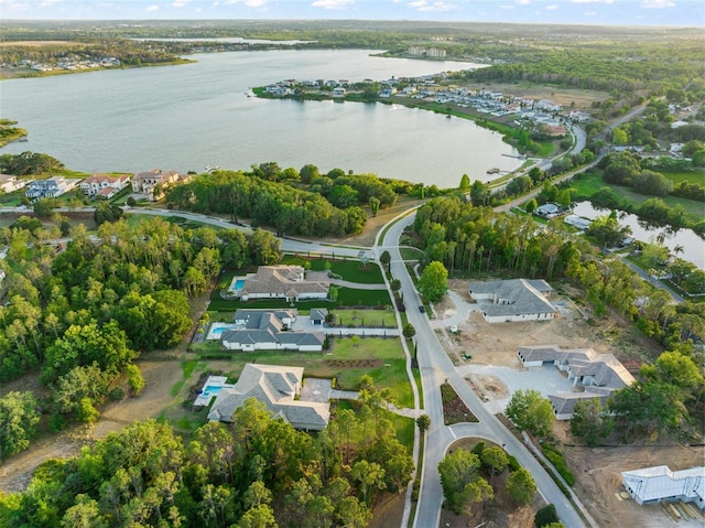 bird's eye view featuring a residential view and a water view