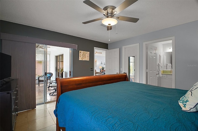 bedroom featuring ceiling fan and ensuite bath