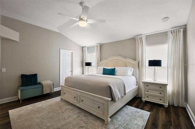 bedroom with dark wood-style floors, ceiling fan, vaulted ceiling, and baseboards