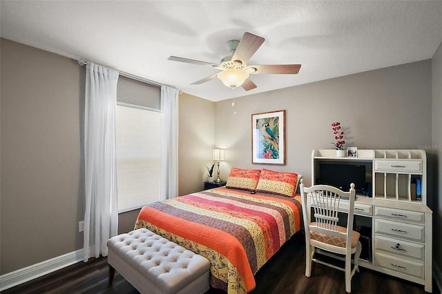 bedroom with dark wood-style floors, ceiling fan, and baseboards
