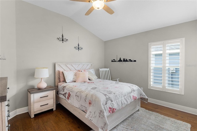 bedroom featuring baseboards, ceiling fan, vaulted ceiling, and dark wood finished floors