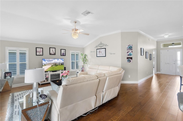 living room featuring visible vents, plenty of natural light, ceiling fan, and wood finished floors
