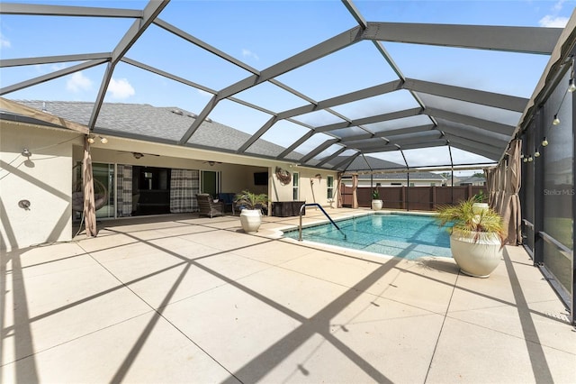 view of swimming pool with a patio, ceiling fan, fence, and a fenced in pool