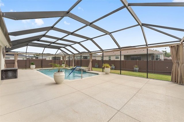 view of swimming pool with a patio, a fenced in pool, a lanai, and a fenced backyard