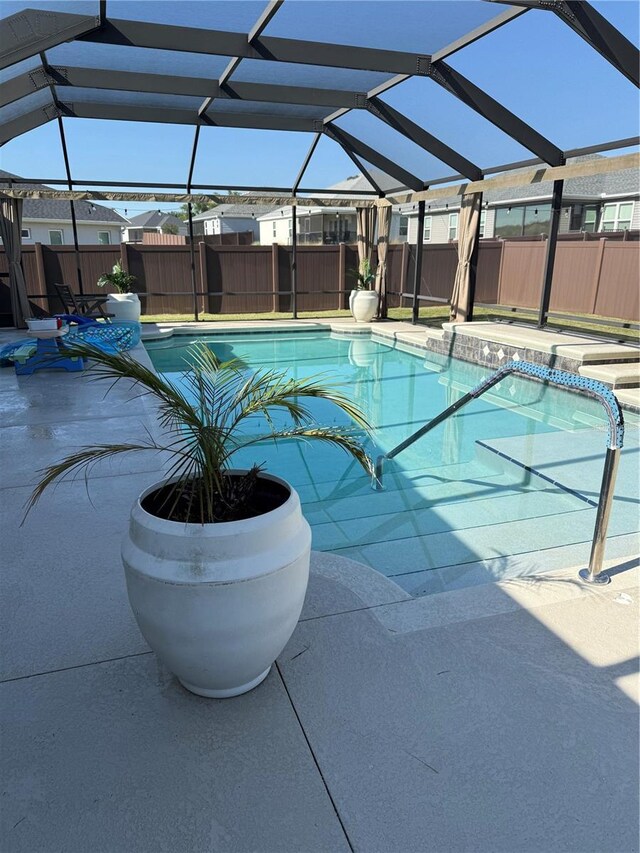 view of pool featuring a fenced in pool, a fenced backyard, and a water slide