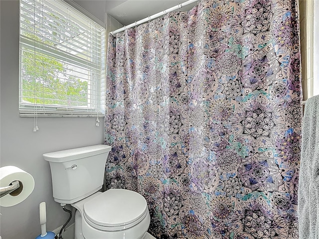 1001 N Lakeshore Blvd, Howey In The Hills, FL 34737 - bathroom featuring toilet and curtained shower