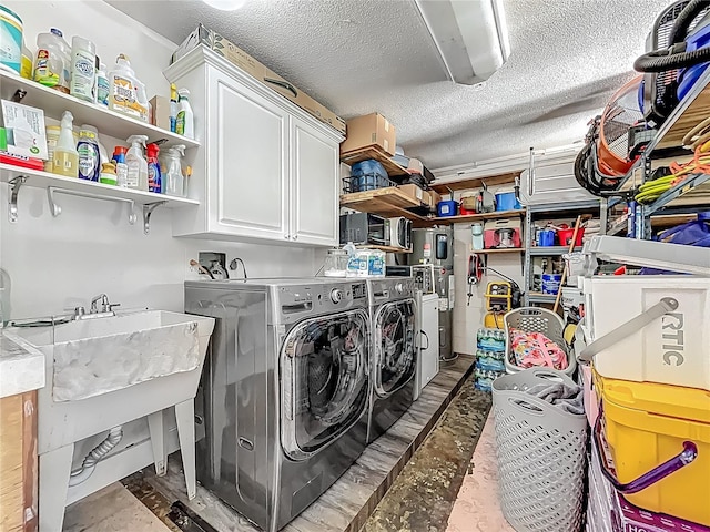 1001 N Lakeshore Blvd, Howey In The Hills, FL 34737 - clothes washing area featuring cabinet space, independent washer and dryer, and a textured ceiling