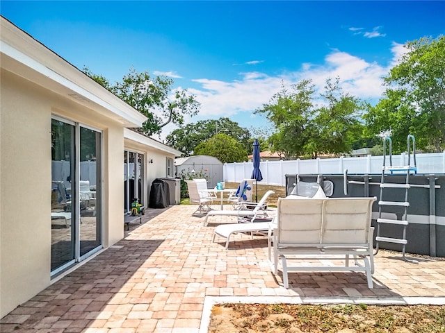 1001 N Lakeshore Blvd, Howey In The Hills, FL 34737 - view of patio featuring a fenced backyard and outdoor dining area