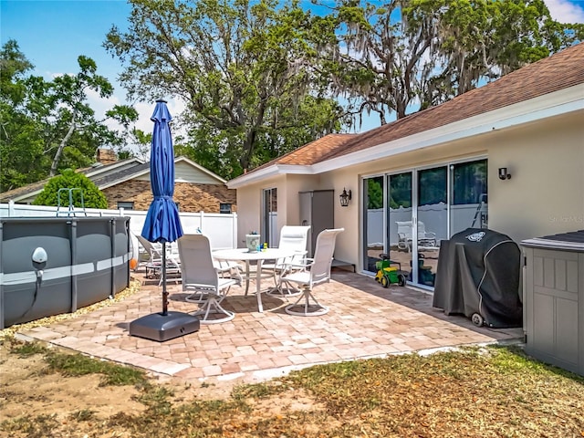 1001 N Lakeshore Blvd, Howey In The Hills, FL 34737 - view of patio featuring outdoor dining area and fence