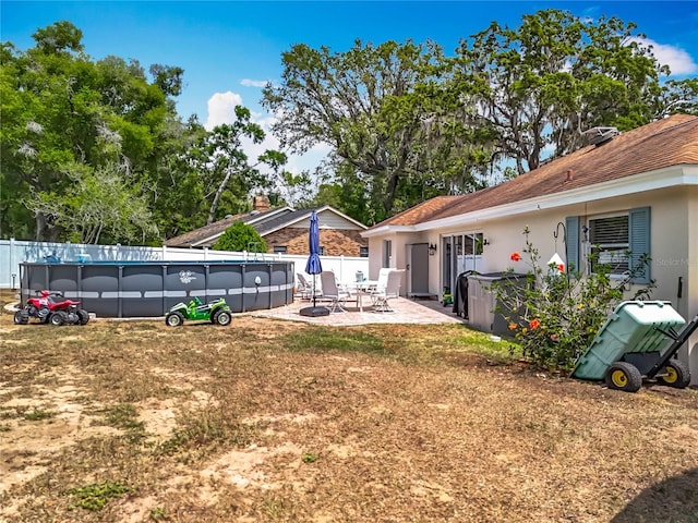 1001 N Lakeshore Blvd, Howey In The Hills, FL 34737 - view of yard featuring a patio area, fence, and a fenced in pool