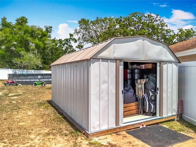 1001 N Lakeshore Blvd, Howey In The Hills, FL 34737 - view of shed with a fenced in pool