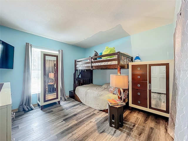 1001 N Lakeshore Blvd, Howey In The Hills, FL 34737 - bedroom with wood finished floors