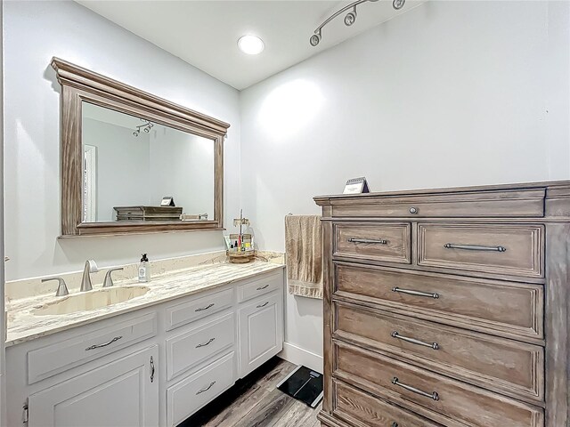 1001 N Lakeshore Blvd, Howey In The Hills, FL 34737 - bathroom with vanity and wood finished floors