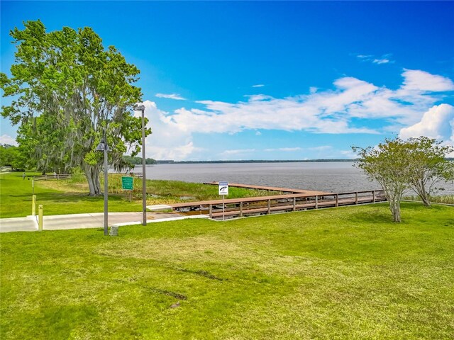 1001 N Lakeshore Blvd, Howey In The Hills, FL 34737 - view of property's community featuring a water view and a yard