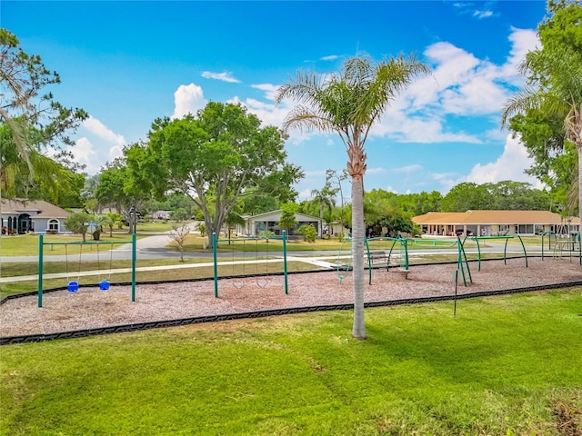 1001 N Lakeshore Blvd, Howey In The Hills, FL 34737 - view of home's community featuring a lawn and playground community