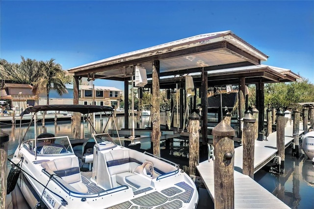 dock area featuring a water view and boat lift