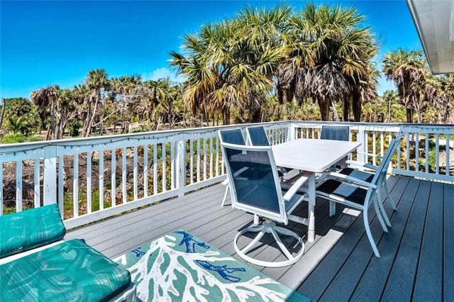 wooden deck featuring outdoor dining space