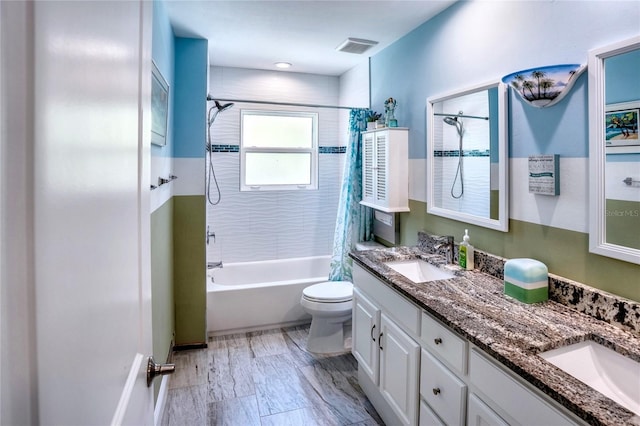 bathroom with shower / bath combo with shower curtain, toilet, visible vents, and a sink