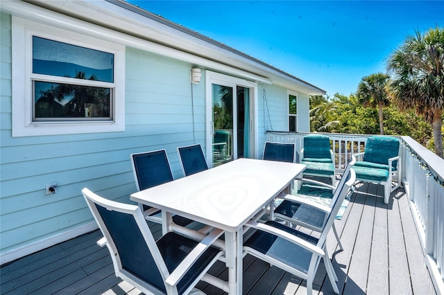 wooden deck with outdoor dining space