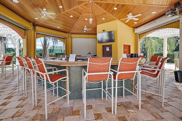 dining space with wood ceiling, a ceiling fan, and recessed lighting