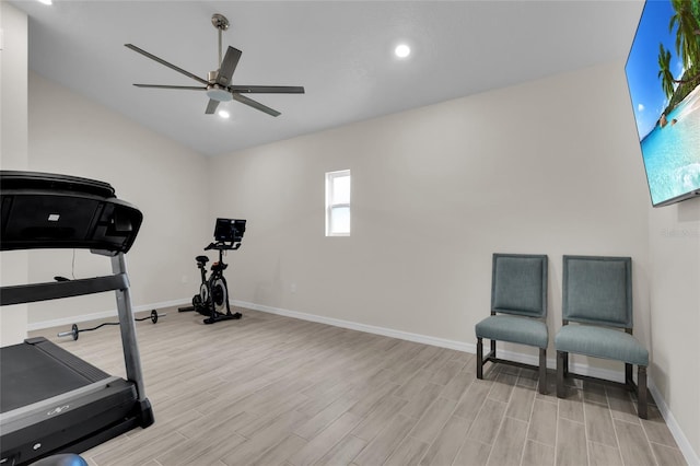 workout area featuring ceiling fan, baseboards, and light wood-type flooring