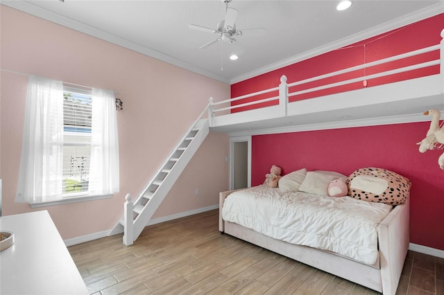 bedroom with crown molding, recessed lighting, wood finished floors, and baseboards