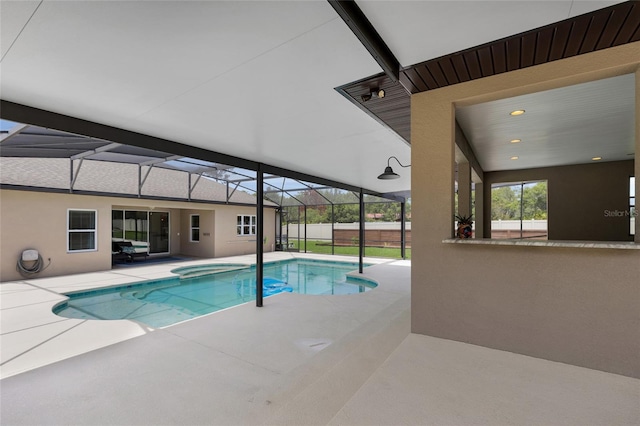 view of swimming pool with a patio, glass enclosure, a hot tub, and a fenced in pool