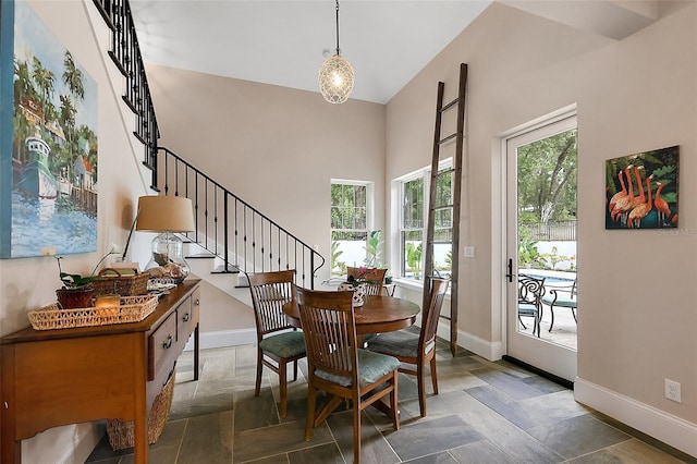 6905 Clayton St, Mount Dora, FL 32757 - dining room featuring baseboards, stairway, and a high ceiling