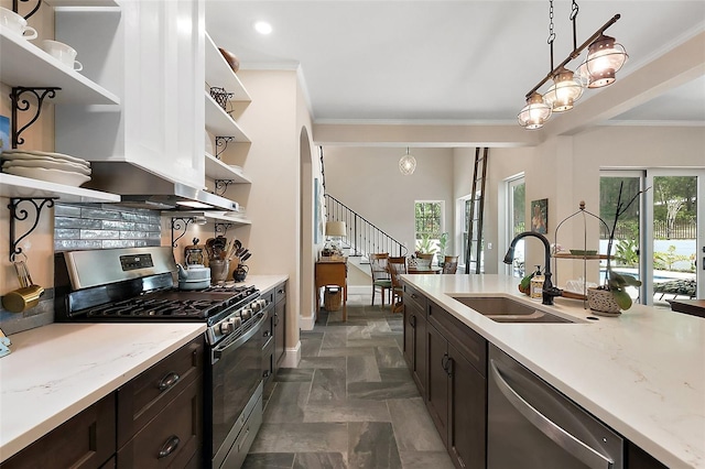 6905 Clayton St, Mount Dora, FL 32757 - kitchen with open shelves, stainless steel appliances, a sink, ornamental molding, and dark brown cabinetry