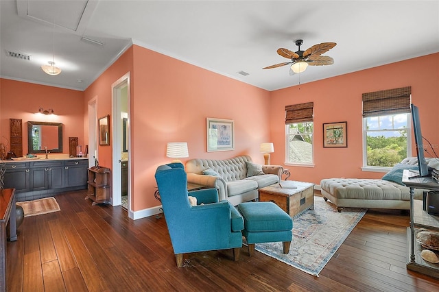 6905 Clayton St, Mount Dora, FL 32757 - living room with attic access, a ceiling fan, dark wood-style floors, ornamental molding, and baseboards