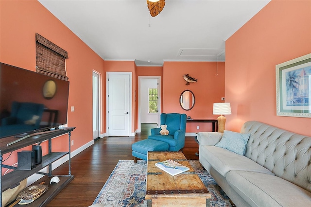 6905 Clayton St, Mount Dora, FL 32757 - living room with dark wood-type flooring, baseboards, crown molding, and attic access