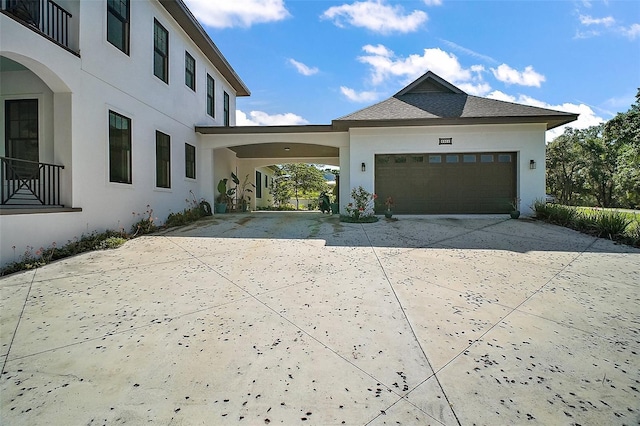 6905 Clayton St, Mount Dora, FL 32757 - view of home's exterior featuring driveway, stucco siding, and a garage
