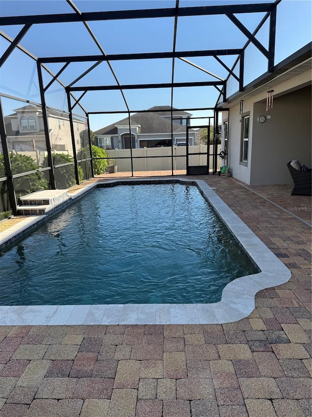 outdoor pool featuring a patio and a lanai