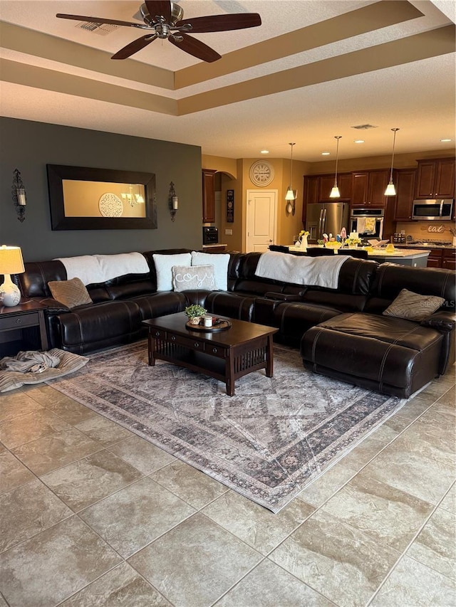 2504 Cavender Creek Rd, Minneola, FL 34715 - living area with a ceiling fan and arched walkways
