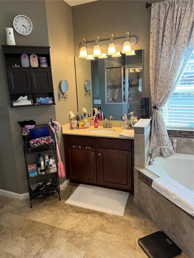 2504 Cavender Creek Rd, Minneola, FL 34715 - bathroom featuring a garden tub, vanity, and a tile shower