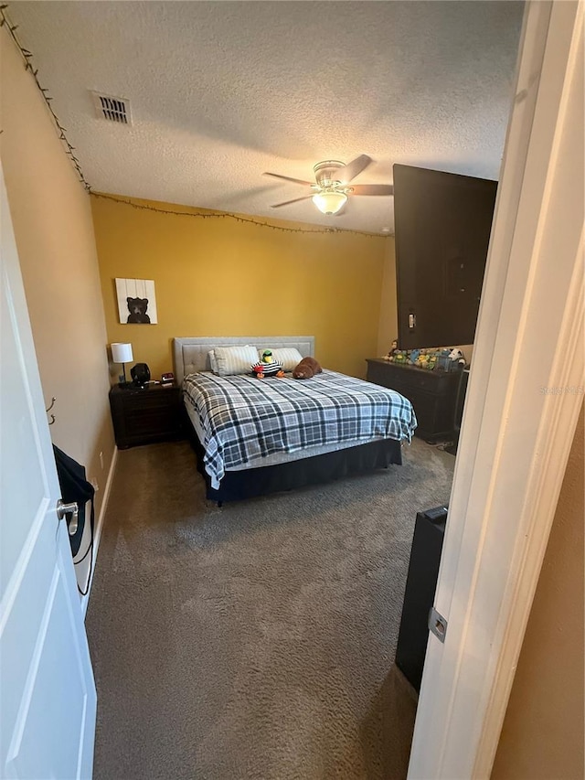 2504 Cavender Creek Rd, Minneola, FL 34715 - carpeted bedroom with a textured ceiling and ceiling fan