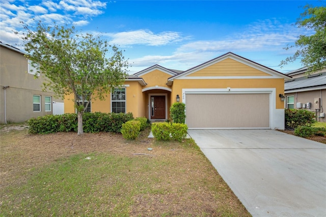 ranch-style home with stucco siding, concrete driveway, and an attached garage