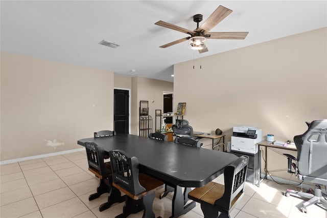 dining space featuring light tile patterned flooring, visible vents, ceiling fan, and baseboards