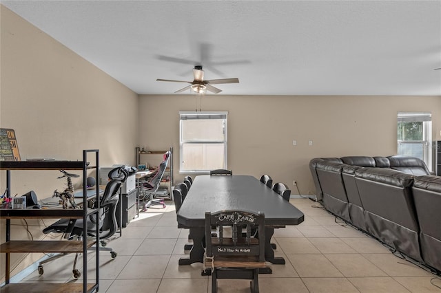 dining room featuring light tile patterned floors and a ceiling fan