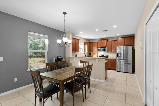 dining space featuring baseboards, recessed lighting, light tile patterned floors, and a healthy amount of sunlight