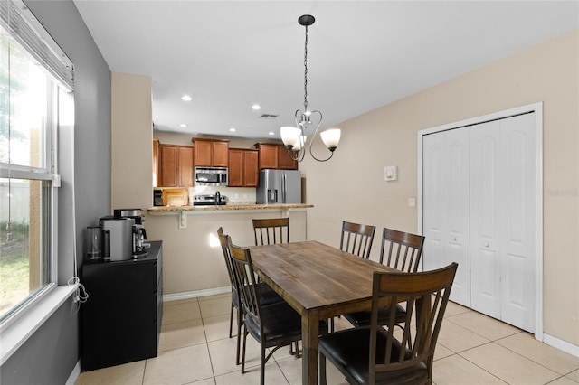 dining area with recessed lighting, an inviting chandelier, light tile patterned flooring, visible vents, and baseboards