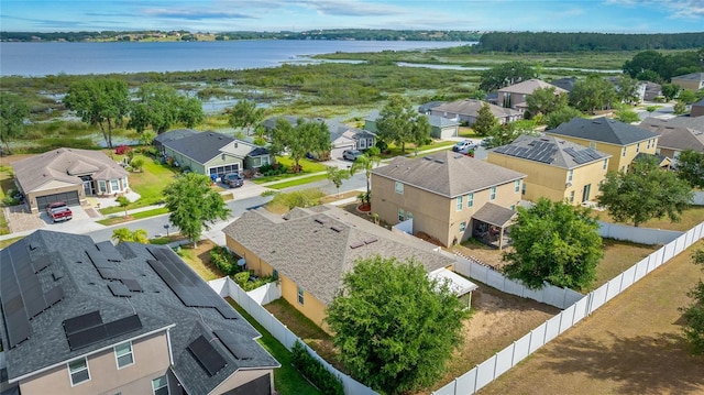 birds eye view of property featuring a water view and a residential view