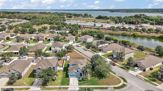 birds eye view of property with a residential view and a water view