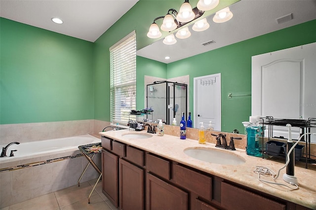 full bathroom with a bath, a sink, a shower stall, and visible vents