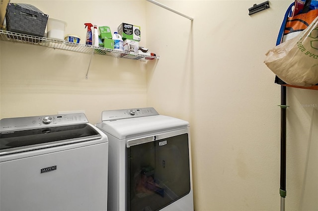 laundry room featuring washer and clothes dryer and laundry area