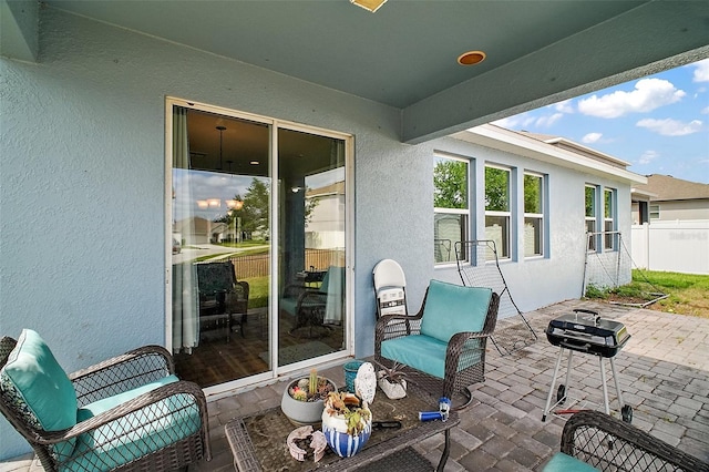 view of patio / terrace featuring fence